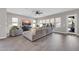 Bright living room with large windows and contemporary furnishings at 4013 N Founder Cir, Buckeye, AZ 85396