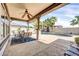 Outdoor covered patio featuring a ceiling fan and view of a pool at 4013 N Founder Cir, Buckeye, AZ 85396