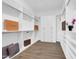 Spacious walk-in closet featuring custom shelving, drawers, and ample storage with wood-look tile flooring at 4013 N Founder Cir, Buckeye, AZ 85396
