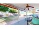 The home's backyard features an outdoor patio, a grill, and several fruit trees at 4014 W Anderson Dr, Glendale, AZ 85308