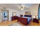 Bedroom featuring hardwood floors and an ensuite bathroom at 4014 W Anderson Dr, Glendale, AZ 85308