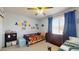 Comfortable bedroom with a built in closet, a dresser, and colorful decor at 4014 W Anderson Dr, Glendale, AZ 85308