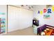 Well-organized ' room with a closet, and colorful wall decorations at 4014 W Anderson Dr, Glendale, AZ 85308