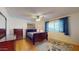 Cozy bedroom with hardwood floors, natural light, and a comfortable sleeping area at 4014 W Anderson Dr, Glendale, AZ 85308