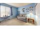 Bedroom features a futon and shelves at 4014 W Anderson Dr, Glendale, AZ 85308