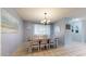 Neutral dining area with lots of light, featuring a classic chandelier, neutral colors, and views at 4014 W Anderson Dr, Glendale, AZ 85308
