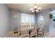 Bright dining area featuring a classic chandelier, a neutral color scheme, and lots of light at 4014 W Anderson Dr, Glendale, AZ 85308
