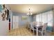 Bright dining area with a neutral color scheme, a classic chandelier, and lots of light at 4014 W Anderson Dr, Glendale, AZ 85308