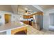 Open kitchen featuring a spacious countertop, stainless steel appliances, and a ceiling fan at 4014 W Anderson Dr, Glendale, AZ 85308