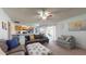 Comfortable living area with modern decor, flowing seamlessly into the dining area and kitchen at 4014 W Anderson Dr, Glendale, AZ 85308