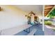 A covered patio with a ceiling fan and comfortable seating, offers a delightful view of the backyard and pool at 4014 W Anderson Dr, Glendale, AZ 85308