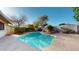 A refreshing pool surrounded by lush landscaping and a concrete deck, offers a perfect escape for relaxation and recreation at 4014 W Anderson Dr, Glendale, AZ 85308