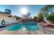 Refreshing pool surrounded by concrete patio, perfect for relaxation and enjoying the outdoor space at 4014 W Anderson Dr, Glendale, AZ 85308