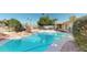 A sparkling pool surrounded by mature trees and landscaping, providing a serene oasis for relaxation and enjoyment at 4014 W Anderson Dr, Glendale, AZ 85308