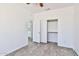 Bedroom featuring wood-look flooring, access to the bathroom, and closet at 516 N Emery --, Mesa, AZ 85207