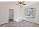 Bedroom with a window, ceiling fan, wood-look flooring, and an open closet at 516 N Emery --, Mesa, AZ 85207