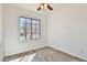 Bright bedroom with a ceiling fan, wood-look flooring, and a window at 516 N Emery --, Mesa, AZ 85207