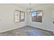 Bright dining area with wood-look flooring and two windows at 516 N Emery --, Mesa, AZ 85207