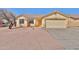 Charming single-story home with a two-car garage and desert landscaping at 516 N Emery --, Mesa, AZ 85207