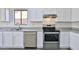 Kitchen with stainless steel appliances and wood-look flooring at 516 N Emery --, Mesa, AZ 85207