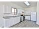 Bright kitchen with modern white cabinets and stainless steel appliances at 516 N Emery --, Mesa, AZ 85207