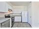 Corner kitchen with white cabinets, stainless steel appliances, and modern design at 516 N Emery --, Mesa, AZ 85207