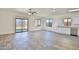 Bright, open-concept living area featuring neutral tile floors and backyard access at 516 N Emery --, Mesa, AZ 85207
