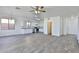 Spacious living area with tile flooring, ceiling fan, and backyard access at 516 N Emery --, Mesa, AZ 85207