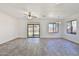 Open floor plan showing the living room with tile floors and backyard access at 516 N Emery --, Mesa, AZ 85207