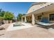 Beautiful outdoor space with a covered patio, hot tub, and a cozy hammock for relaxation at 5309 W Angela Dr, Glendale, AZ 85308