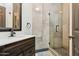 Modern bathroom with a glass shower, vanity with white countertop, and stylish fixtures at 5309 W Angela Dr, Glendale, AZ 85308