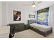 Cozy bedroom featuring carpet flooring, ceiling fan, and a comfortable bed, perfect for relaxation at 5309 W Angela Dr, Glendale, AZ 85308
