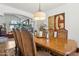 Elegant dining room featuring a decorative chandelier and an adjacent living space at 5309 W Angela Dr, Glendale, AZ 85308