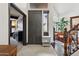 Inviting entryway with tile floors, a gray front door, and views into the adjacent living spaces at 5309 W Angela Dr, Glendale, AZ 85308