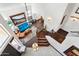 Overhead view of the bright foyer with staircase, chandelier, and access to living room at 5309 W Angela Dr, Glendale, AZ 85308