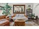 Bright living room featuring hardwood floors and a large mirror at 5309 W Angela Dr, Glendale, AZ 85308