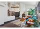 Bright and airy living room boasting high ceilings, dark wood floors, and stylish furnishings at 5309 W Angela Dr, Glendale, AZ 85308