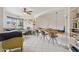 Open-concept living space with bar and seating area, perfect for entertaining and everyday living at 5309 W Angela Dr, Glendale, AZ 85308
