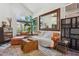 Cozy living room featuring hardwood floors, vaulted ceilings and a large window at 5309 W Angela Dr, Glendale, AZ 85308