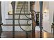 Close-up of elegant staircase featuring decorative iron railing and tile risers at 5309 W Angela Dr, Glendale, AZ 85308