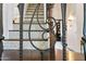 Close-up of elegant staircase featuring decorative iron railing and tile risers at 5309 W Angela Dr, Glendale, AZ 85308