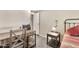 Cozy bedroom with desk, nightstand, and a chair with wood-look vinyl flooring at 5402 E Mckellips Rd # 298, Mesa, AZ 85215
