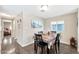 Bright dining room with stylish table and chairs adjacent to hallway at 5402 E Mckellips Rd # 298, Mesa, AZ 85215