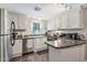 Well-lit kitchen with stainless steel appliances, brown countertops, and white cabinetry at 5402 E Mckellips Rd # 298, Mesa, AZ 85215