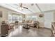 Bright living room boasts wood floors, neutral walls, and large windows for natural light at 5402 E Mckellips Rd # 298, Mesa, AZ 85215
