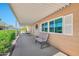 Covered patio with seating offers a relaxing outdoor space and attractive bench and chair set at 5402 E Mckellips Rd # 298, Mesa, AZ 85215