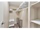 Walk-in closet with ample storage space, shoe rack, hanging bars, and built in shelving at 5402 E Mckellips Rd # 298, Mesa, AZ 85215