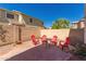 Relaxing backyard featuring a brick patio with comfortable seating and a peaceful ambiance at 5430 S 23Rd Way, Phoenix, AZ 85040