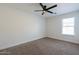 Bedroom featuring neutral tones, plush carpet, ceiling fan and natural light at 5430 S 23Rd Way, Phoenix, AZ 85040