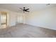 Bedroom boasts a mirrored closet, ceiling fan, and access to another room at 5430 S 23Rd Way, Phoenix, AZ 85040
